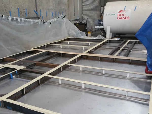 Spray foam equipment set up on a commercial job site